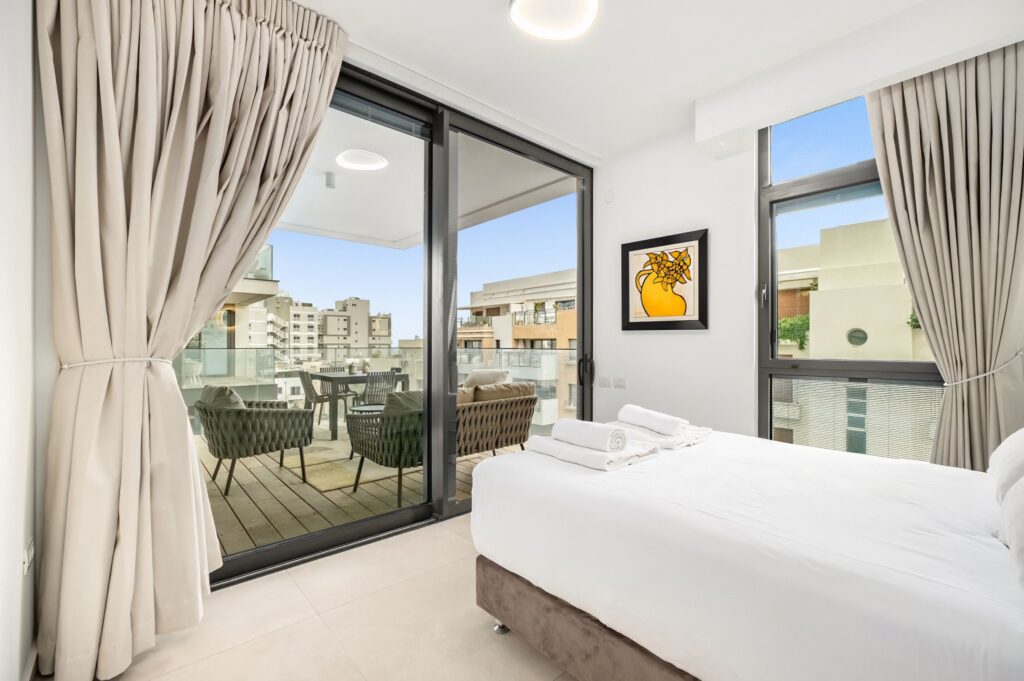 Master bedroom with private terrace in Tel Aviv apartment