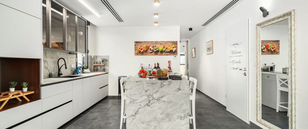 Renovated kitchen with island in Tel Aviv rental apartment