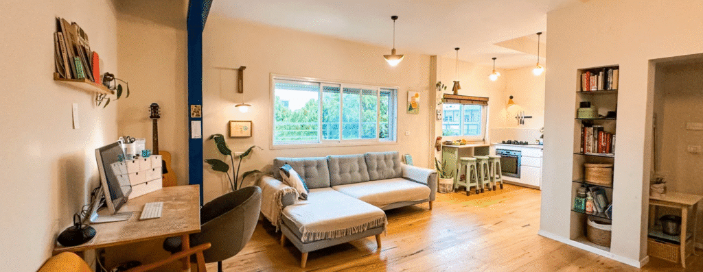 Spacious open-plan living and kitchen area in renovated apartment