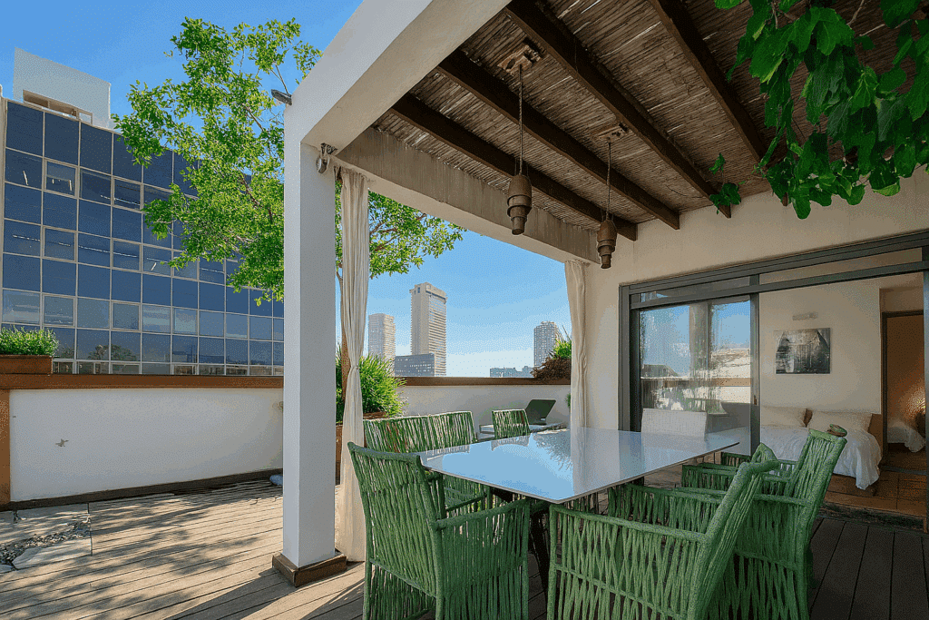 Rooftop terrace with skyline view and outdoor dining area in Tel Aviv penthouse