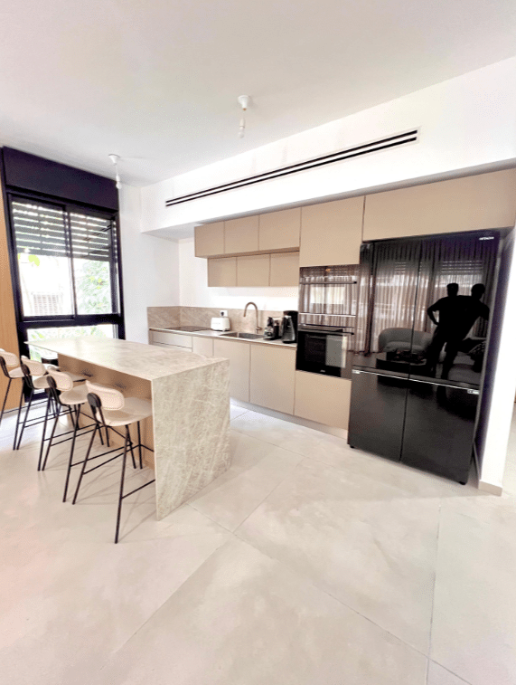 Designer kitchen with built-in appliances and breakfast island